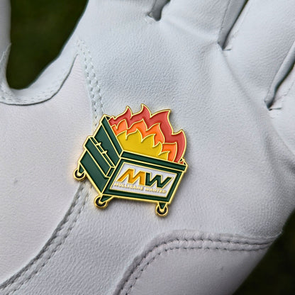 golf ball marker of dumpster on fire that says 'mulligans wanted' in a glove